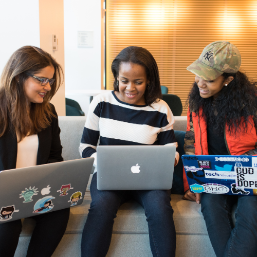 Group of students studying on laptops